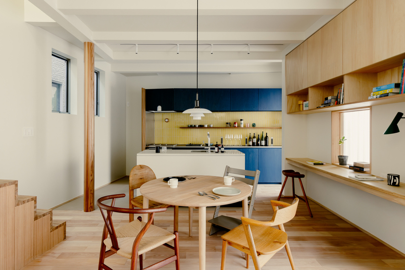 rotated interior wall shapes triangular sunlit voids within tiny wooden house in tokyo