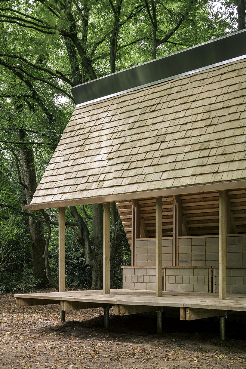 hasselt university students employ reclaimed timber and earth bricks for communal pavilion