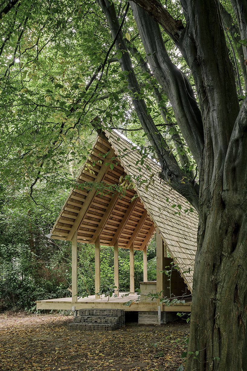 hasselt university students employ reclaimed timber and earth bricks for communal pavilion