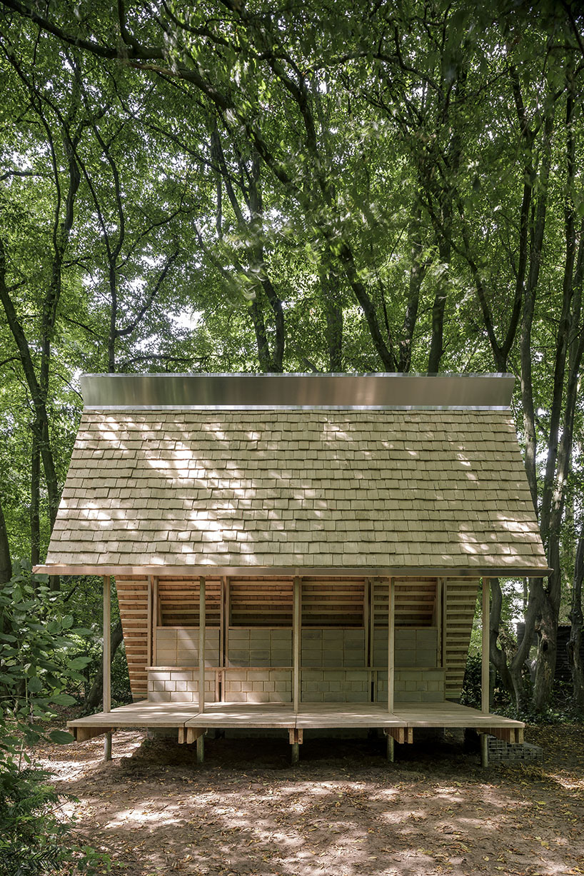 hasselt university students employ reclaimed timber and earth bricks for communal pavilion