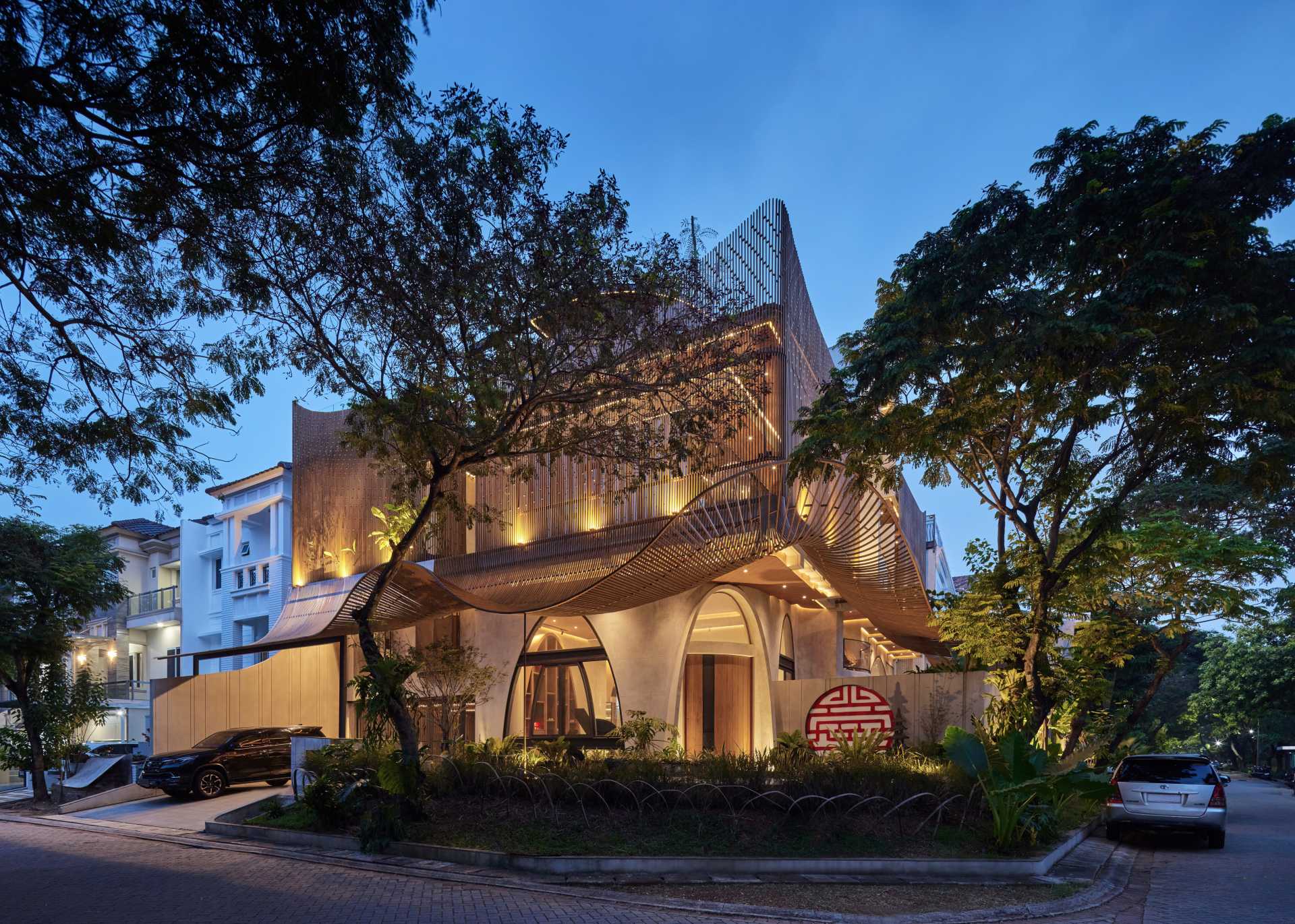 A modern home with operable steel fins on its exterior facade.