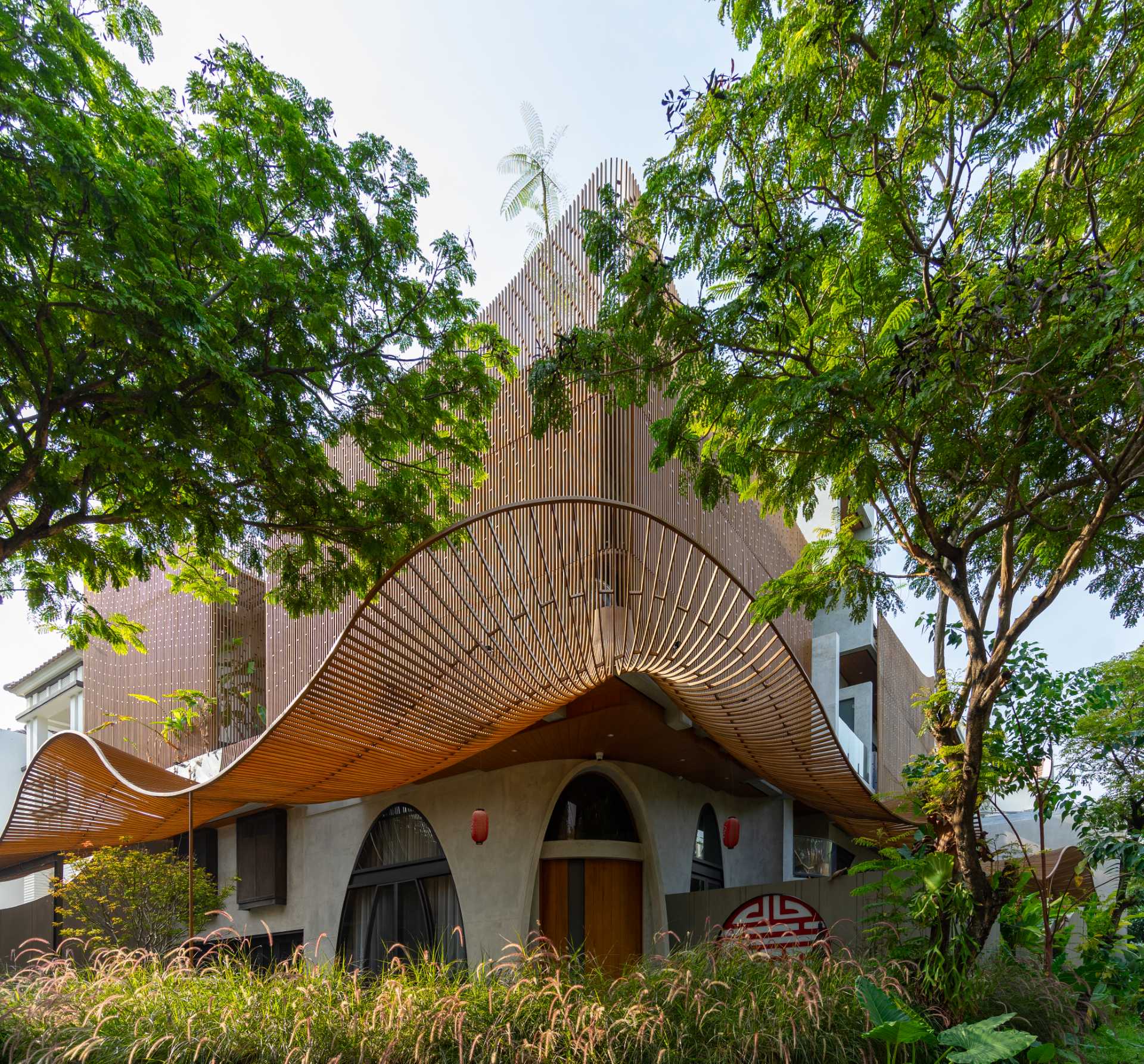 A modern home with operable steel fins on its exterior facade.