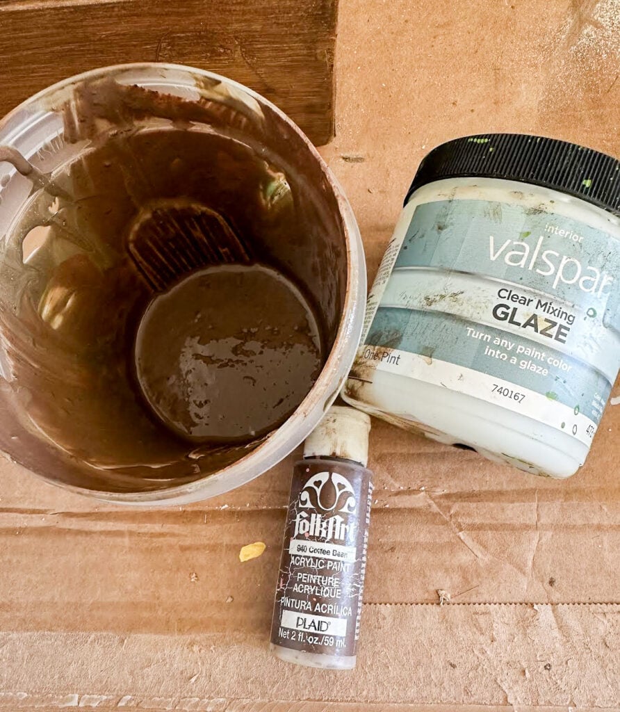 Mixing clear mixing glaze with brown paint use to create a faux wood finish.