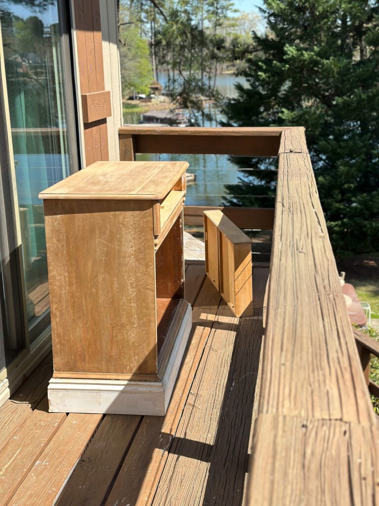 paint stripped wood cabinet set out in the sun to bleach