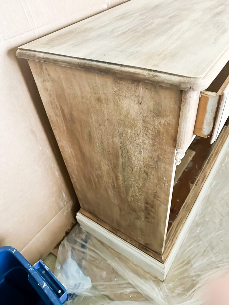side of stripped piece of wood furniture