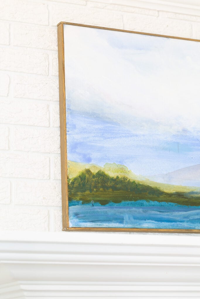 close up of framed art canvas hung on wall