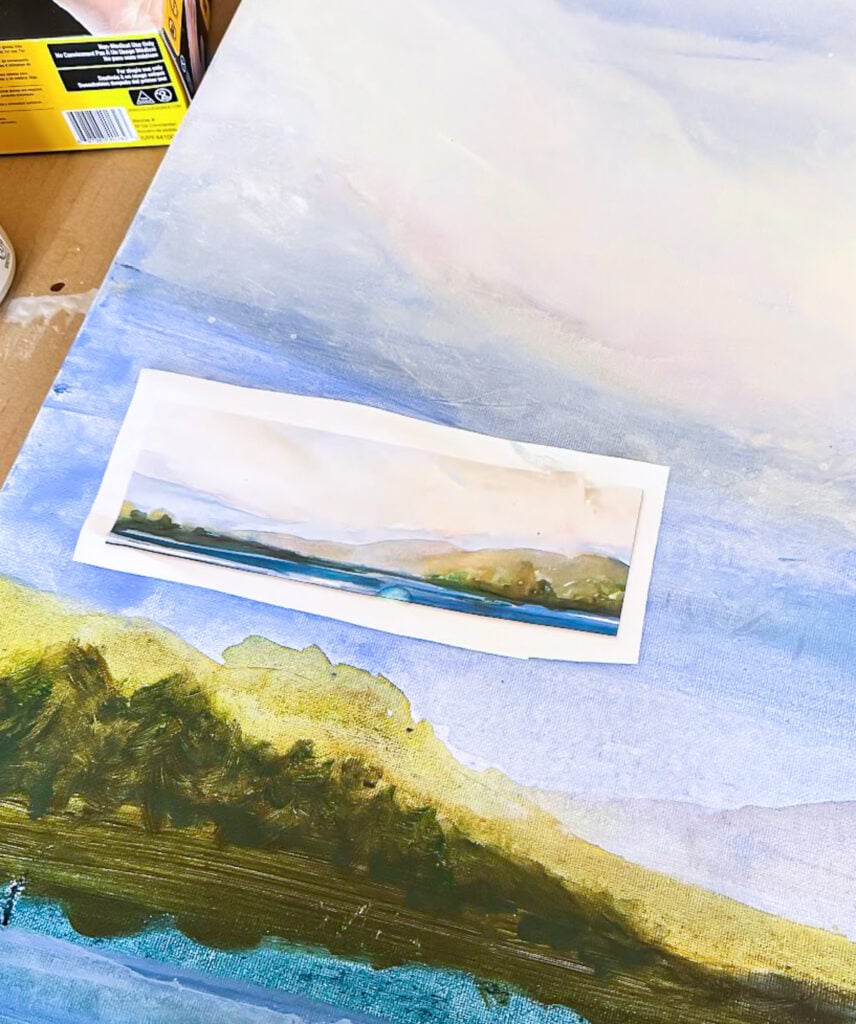 printed watercolor of water and mountains I used as color and image inspiration to paint an art canvas with acrylic paint.