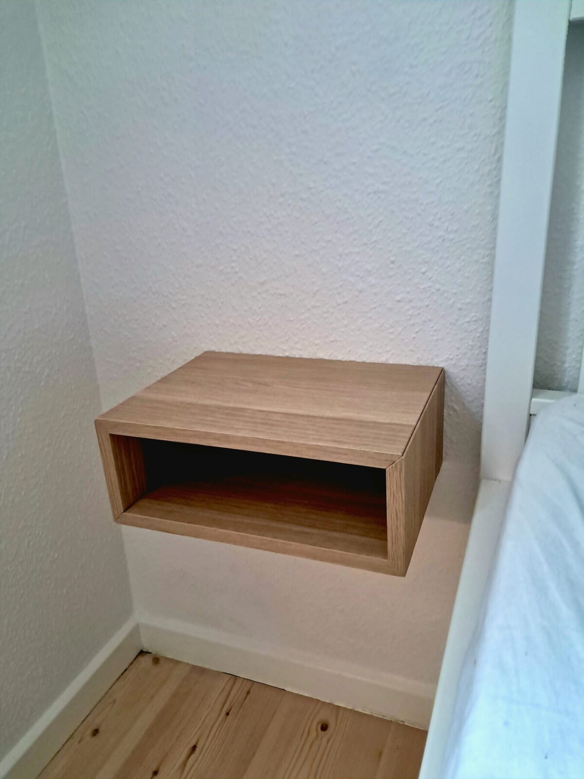 Overpriced Oak Bedside Shelves? Here’s a $20 IKEA Hack That Looks Just as Good 11 ikea eket cabinet half height wall mounted bedside shelf