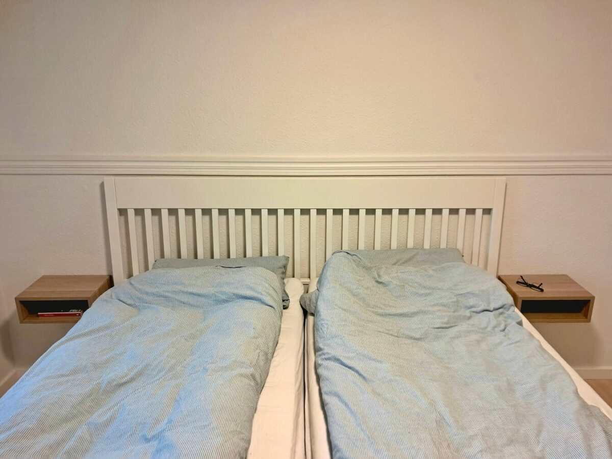 Overpriced Oak Bedside Shelves? Here’s a $20 IKEA Hack That Looks Just as Good 13 ikea eket cabinet half height wall mounted bedside shelf