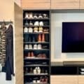 A Random Idea Made The Most Of This Small Living Room Entryway (And It Stores Plenty) 3 TV wall and entryway shoe storage with IKEA kitchen cabinets
