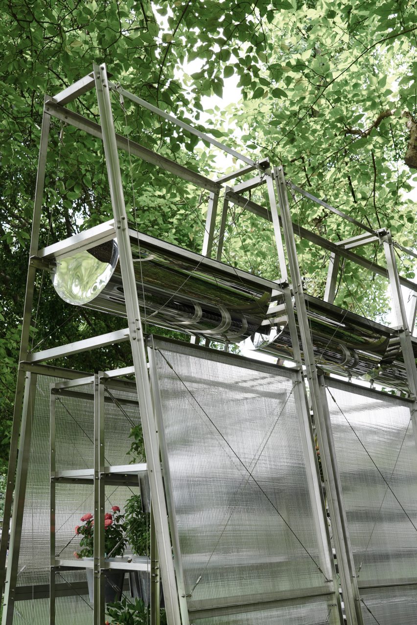 Close-up of water troughs on top of polycarbonate greenhouse