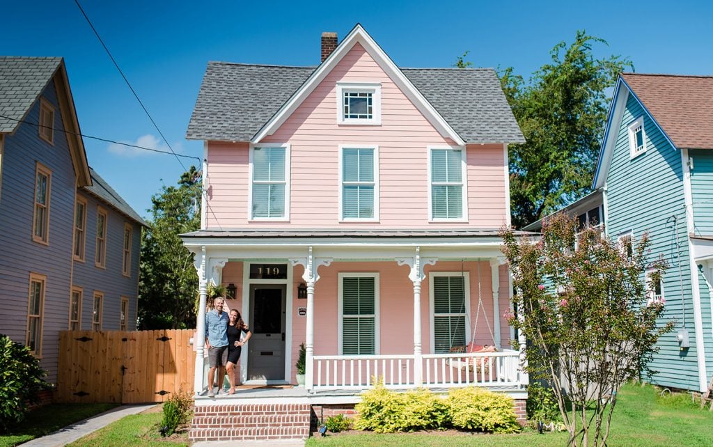 Pink Beach House With Pointy Roof And Large Front Porch 
